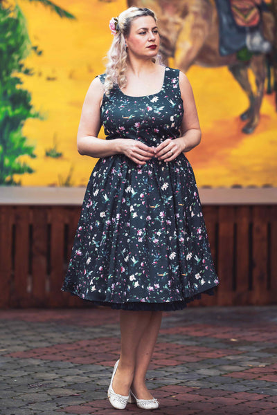 A model wearing a Navy Hummingbird Swing Dress