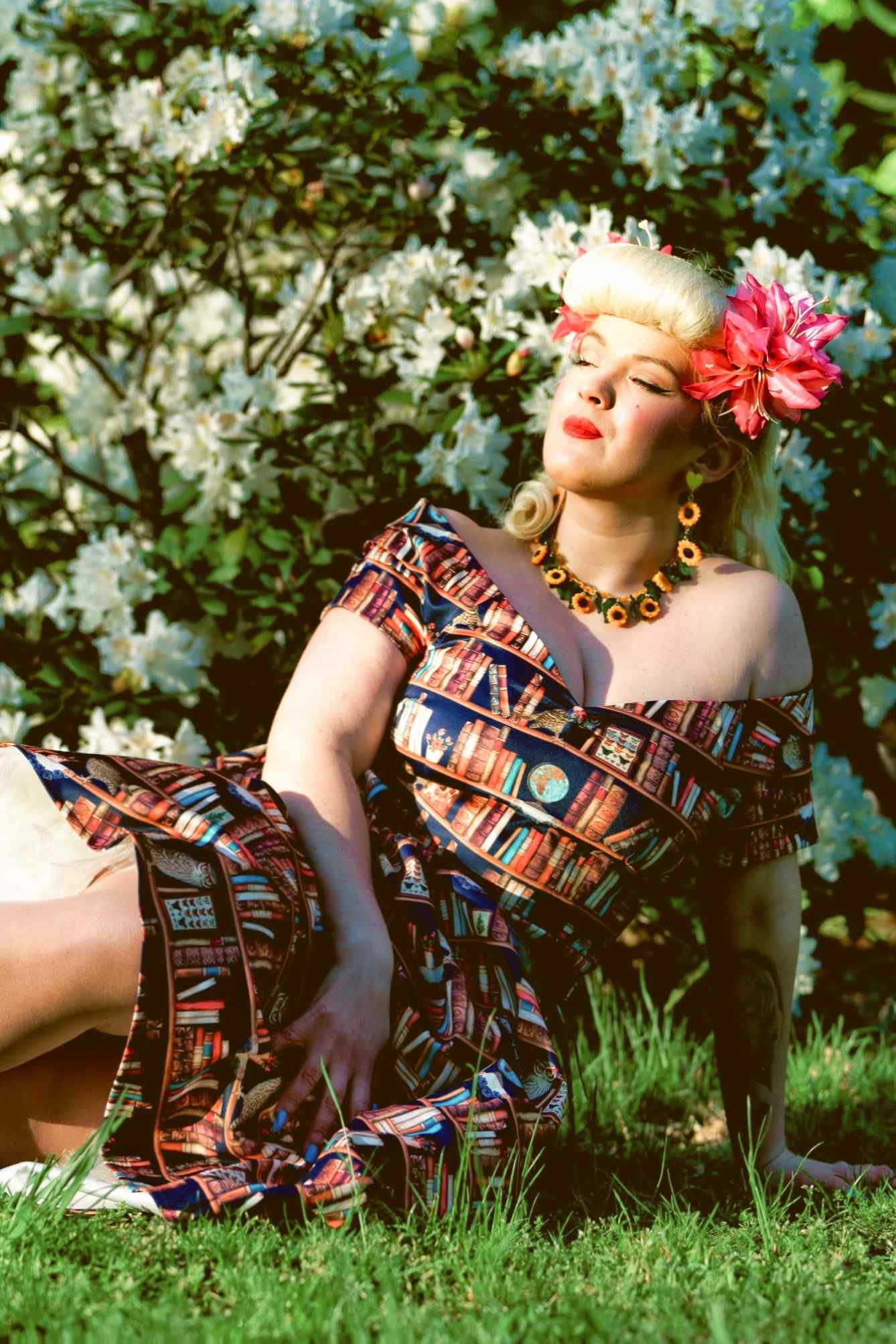 A lady wearing an Off Shoulder Book & Owl Dress