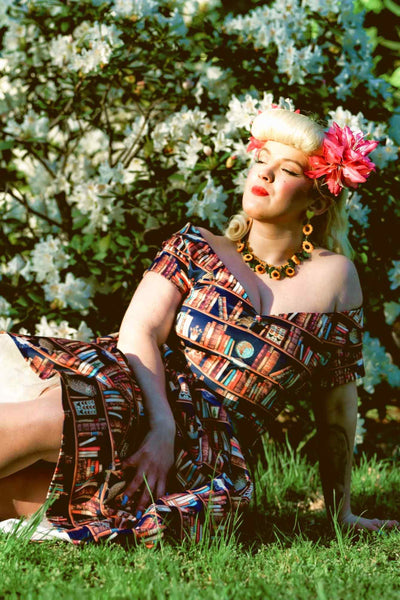 A lady wearing an Off Shoulder Book & Owl Dress