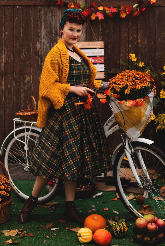 A model wearing a Lily Off Shoulder Green Tartan Check Circle Dress