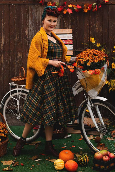 A model wearing a Lily Off Shoulder Green Tartan Check Circle Dress
