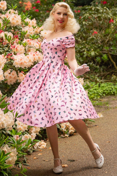 A model wearing a Off Shoulder Pink Butterfly Swing Dress