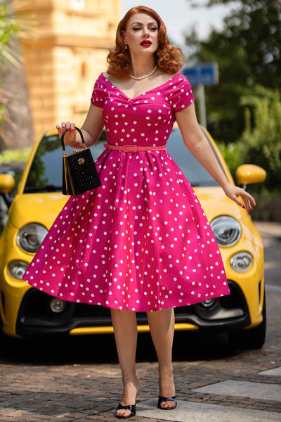 A model wearing a Off-Shoulder Polka Dot Evening Dress in Hot Pink/White