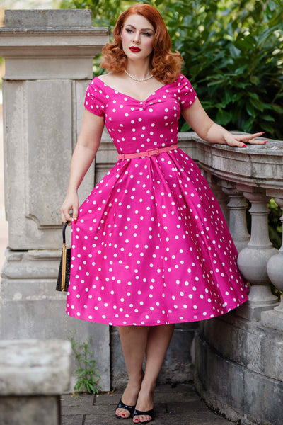 A model wearing a Off-Shoulder Polka Dot Evening Dress in Hot Pink/White