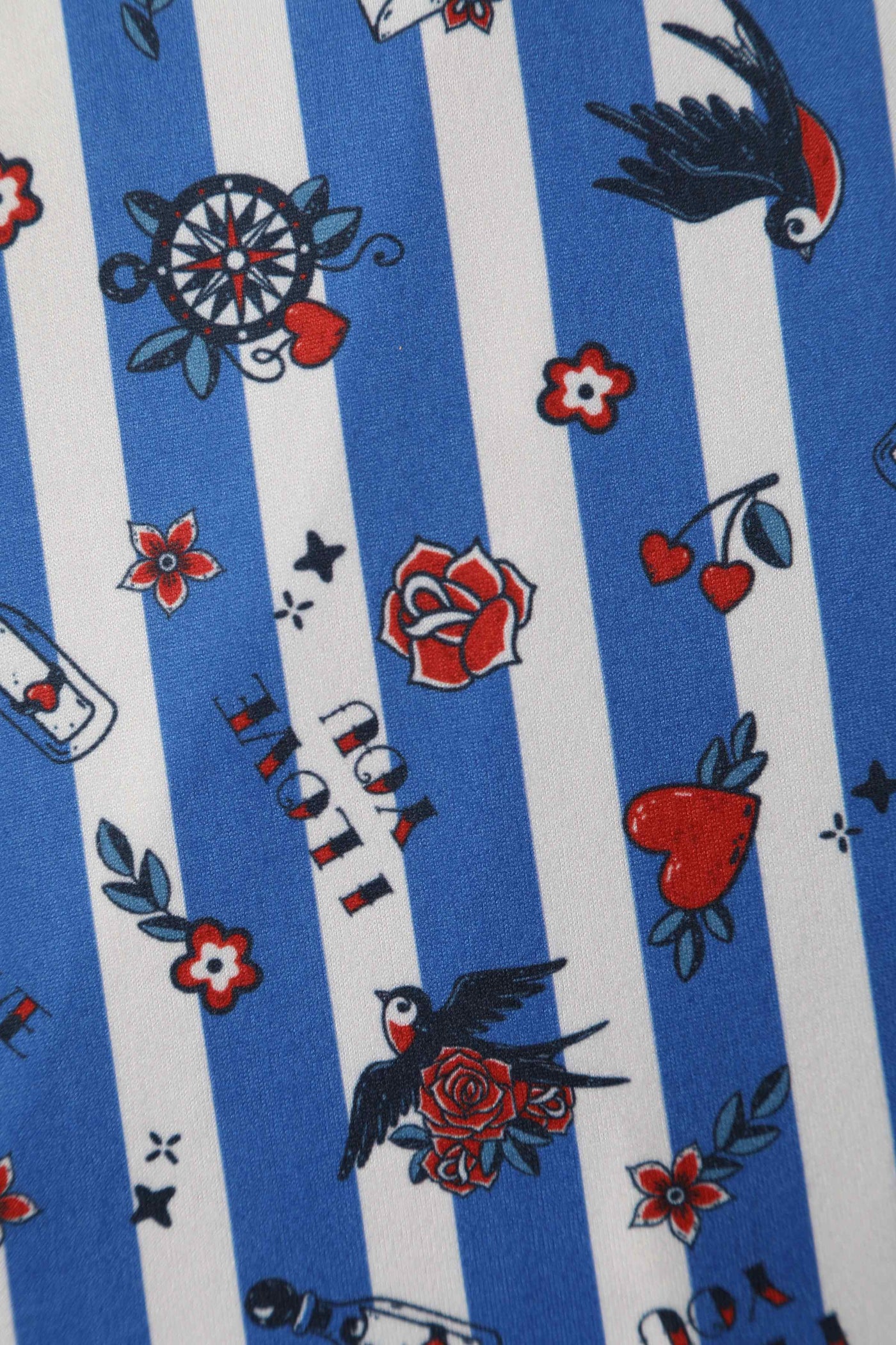 Close Up View of Old School Tattoo Prin with Blue and White Stripes Wrap Dress