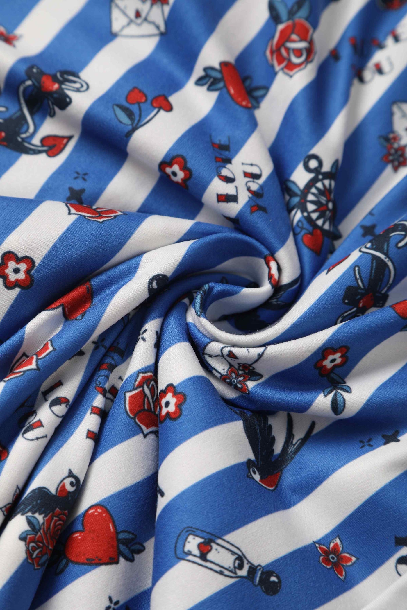 Close Up View of Old School Tattoo Prin with Blue and White Stripes Wrap Dress