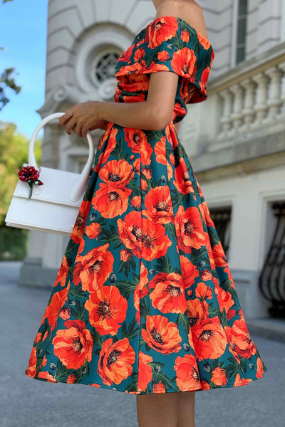 Close up view of A model wearing a Beverly Orange Poppy Off Shoulder Dress In Green