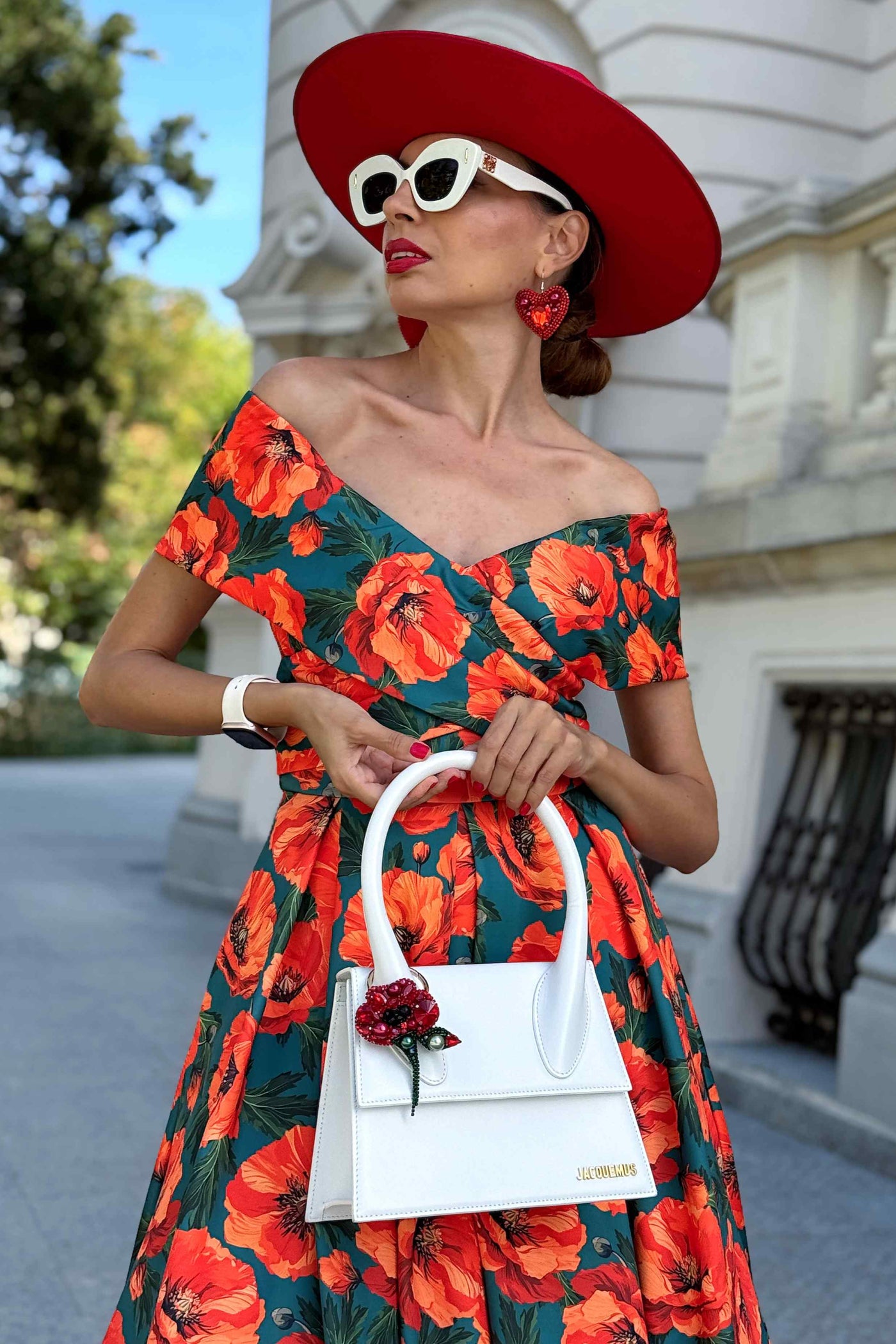 A model wearing a Beverly Orange Poppy Off Shoulder Dress In Green