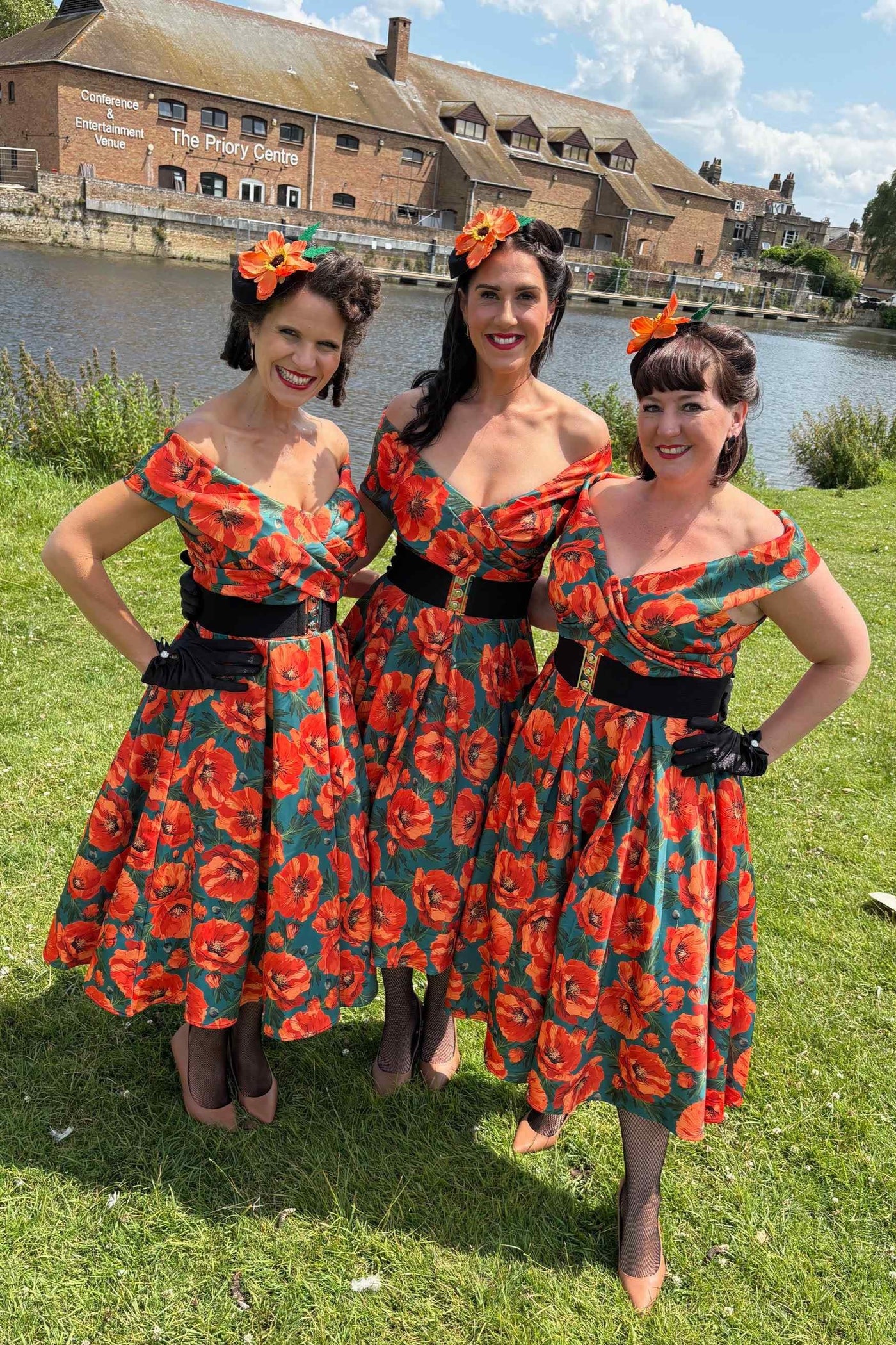 Models wearing Orange Poppy Off Shoulder Dress In Green