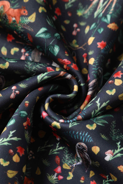 Close up view of Owl & Deer Off Shoulder Dress In Dark Green
