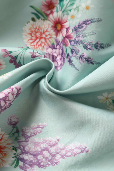 Close up view of Pastel Floral Swing Dress In Baby Blue