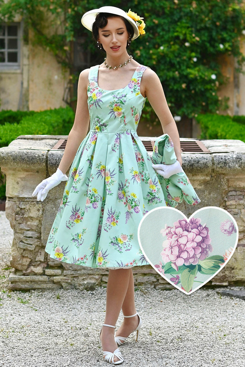 A Model wearing Amanda Pastel Floral Swing Dress In Light Green
