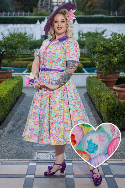 A lady wearing a Mabel Pastel Seashell Midi Shirt Dress