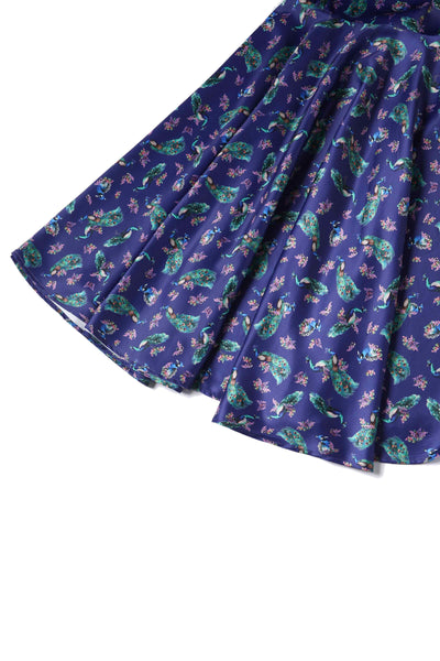 Close up view of Peacock Print Pleated Bust Dress in Purple