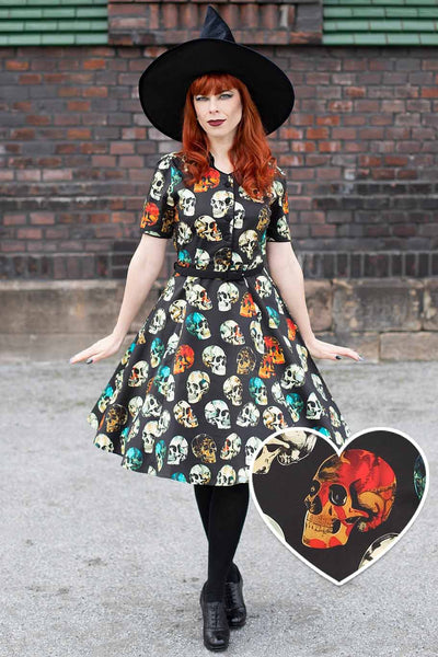 A model wearing a Penelope Rockabilly Black Skull Shirt Dress