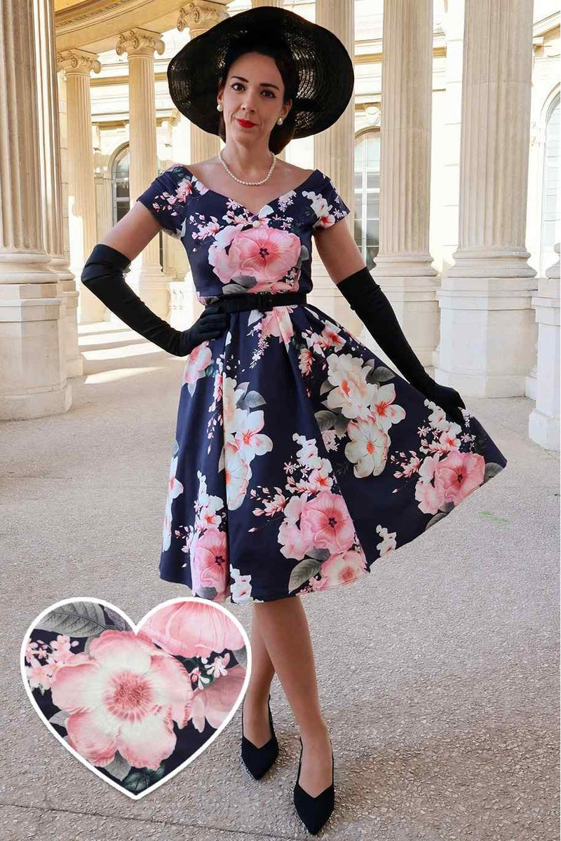 A lady wearing a Peony Off Shoulder Dress