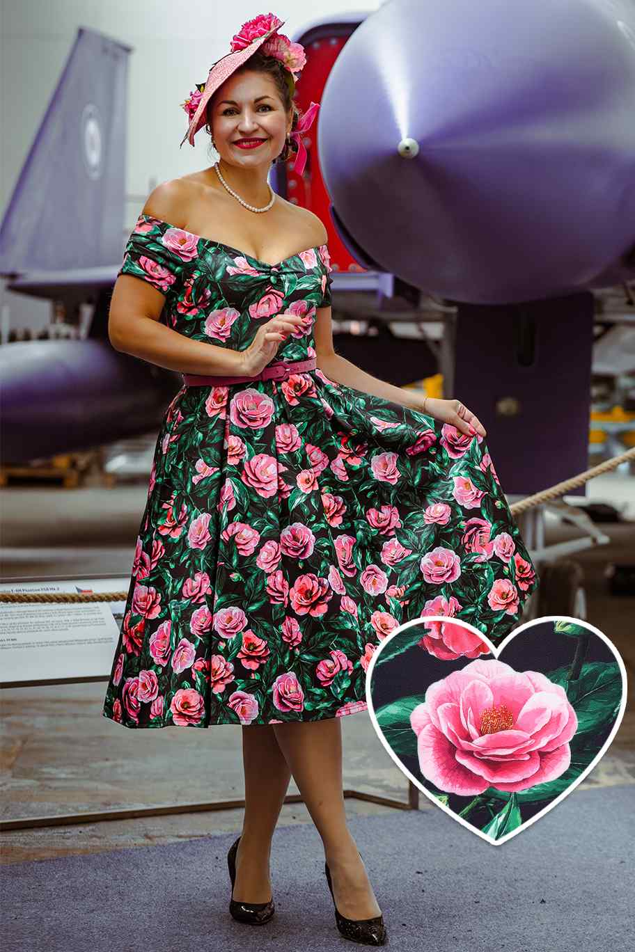 A woman wearing a Lily Pink Camellia Off Shoulder Dress In Black