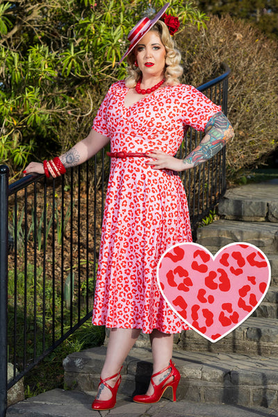 A model wearing a Julia Pink Cheetah Print Midi Dress