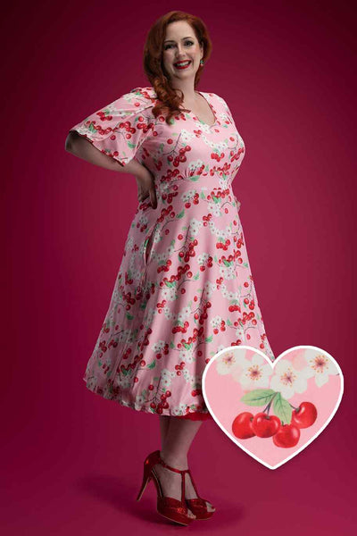 A model wearing Pink Cherry Petal Sleeve Dress