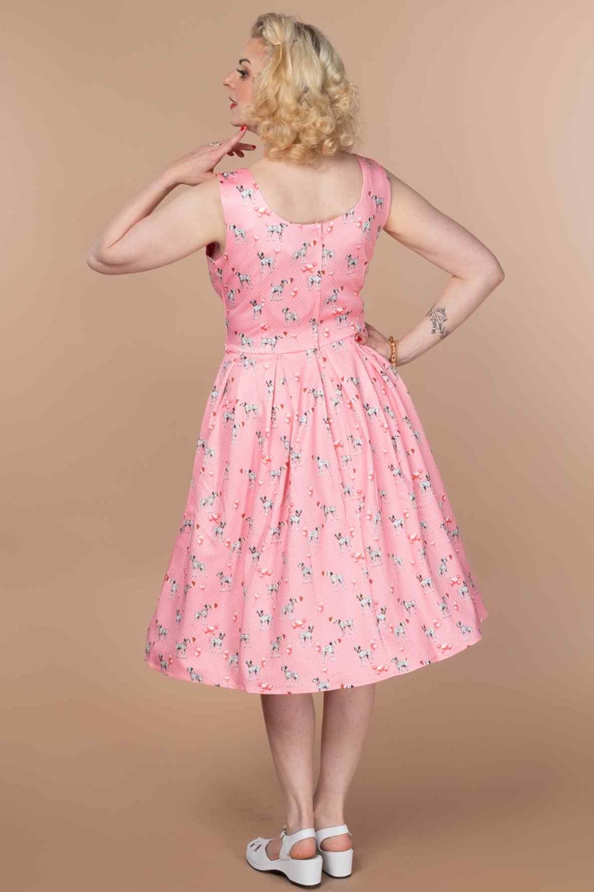 A model wearing a Pink Dalmatian Flared Dress
