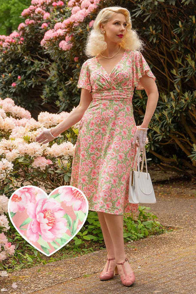 A model wearing Pink Floral Crossover Bust Dress