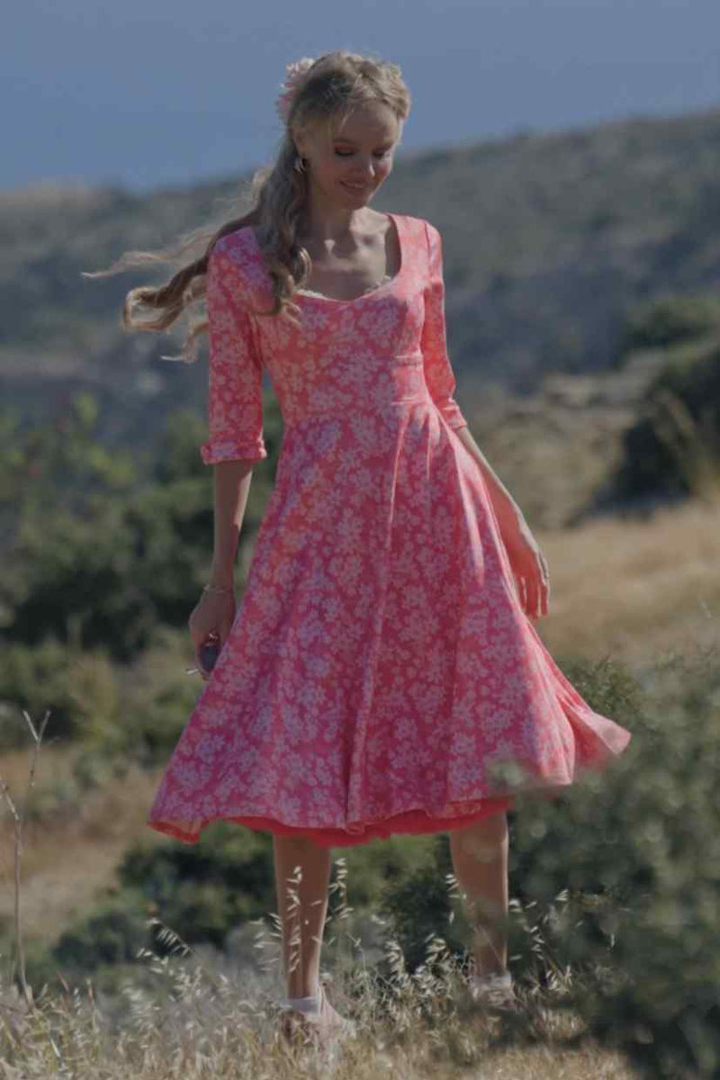 A lady wearing a Pink Floral Garden Circle Dress