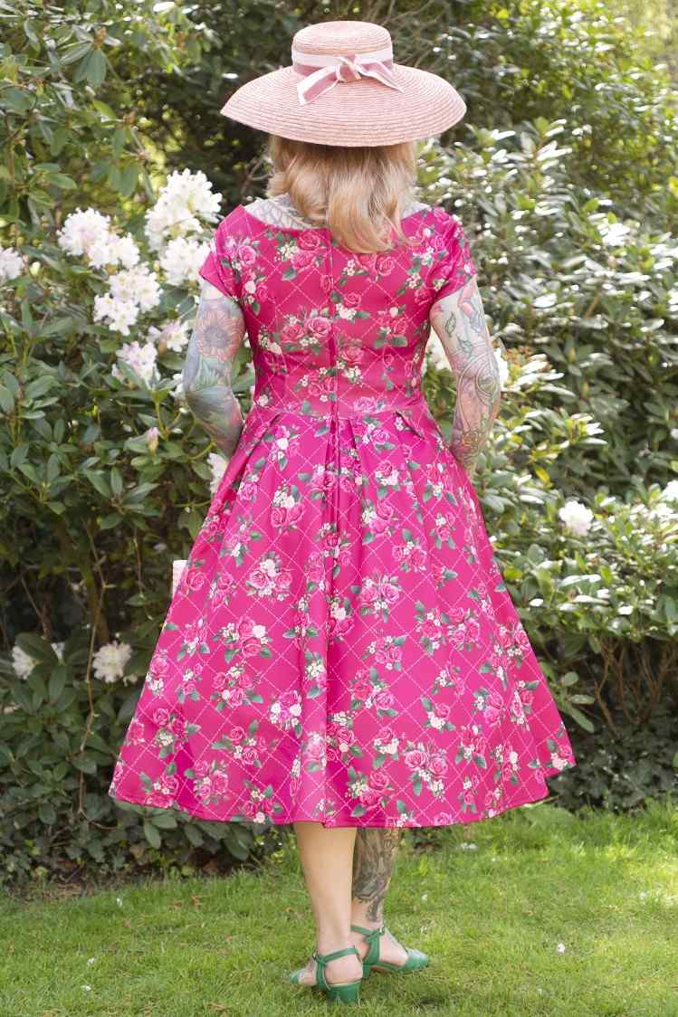 A model wearing Pink Floral Vine Off Shoulder Dress