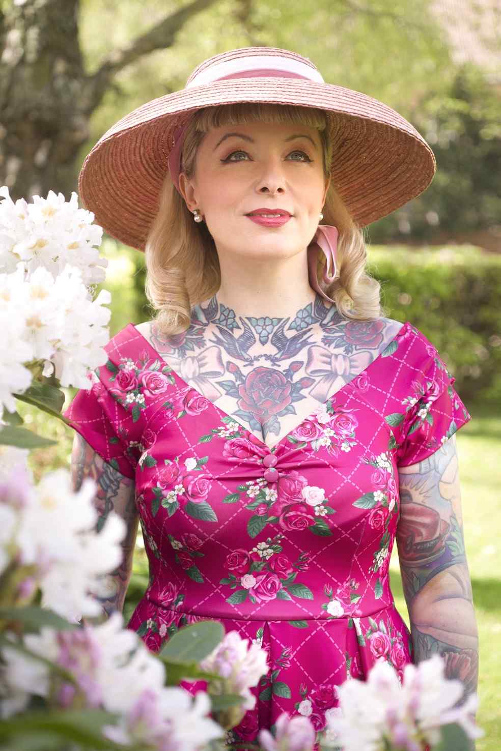 A model wearing Pink Floral Vine Off Shoulder Dress