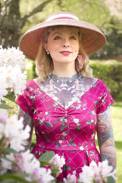 A model wearing Pink Floral Vine Off Shoulder Dress