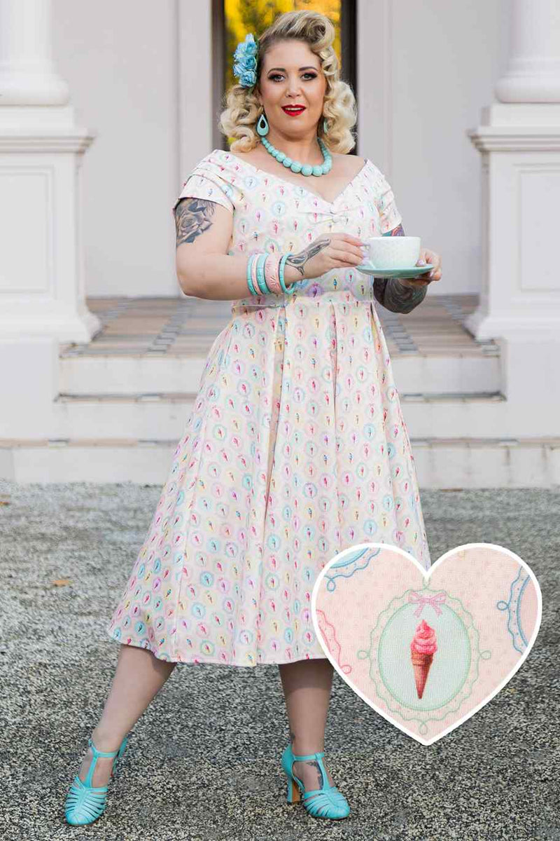 A model wearing Pink Gelato Off Shoulder Dress