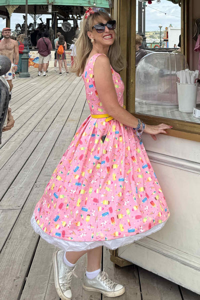 A women wearing Amanda Pink Ice Lolly Swing Dress