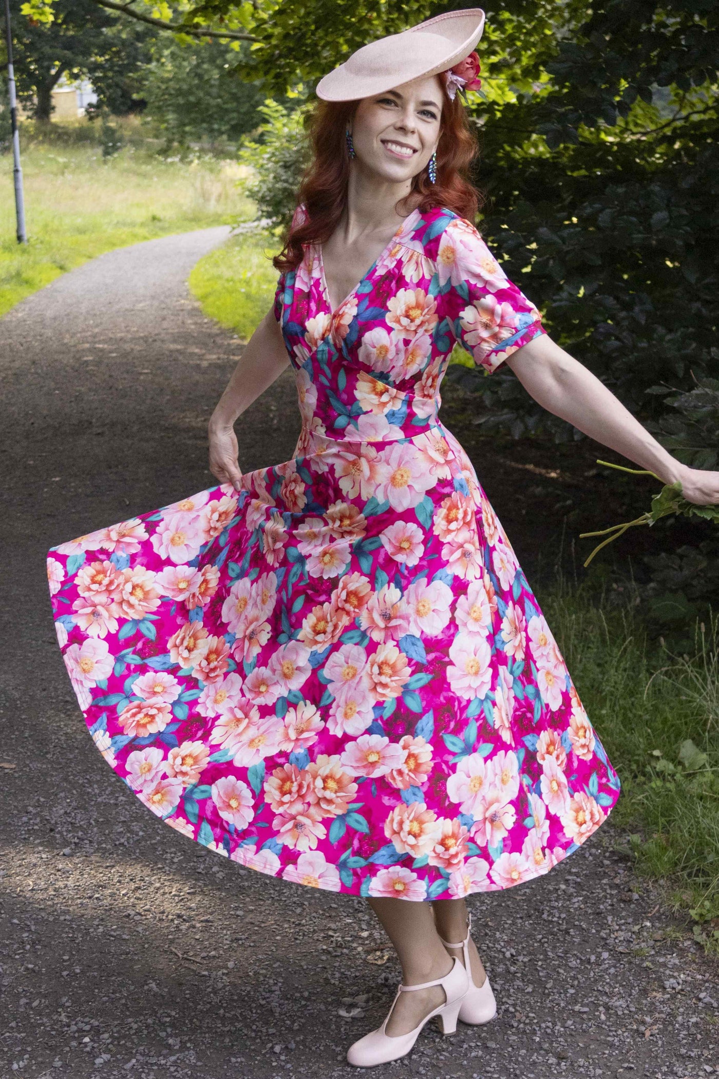 A model wearing a Julia Pink Magnolia Casual Midi Dress