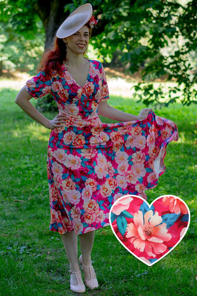 A model in Julia Pink Magnolia Casual Midi Dress