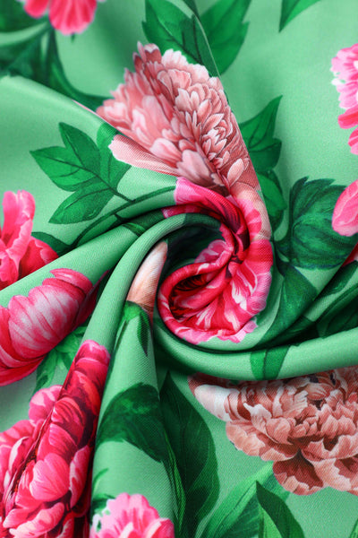 Close up view of Amanda Pink Peony Flared Dress In Mint Green