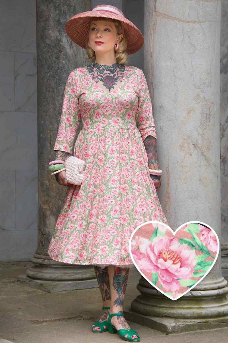 A model wearing Pink Peony Long Sleeved Dress