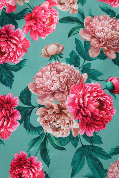 Close up view of Pink Peony Off Shoulder Dress In Mint Green