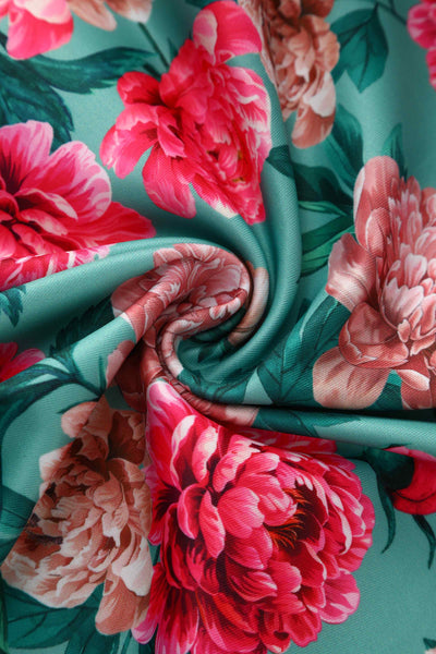 Close up view of Pink Peony Off Shoulder Dress In Mint Green