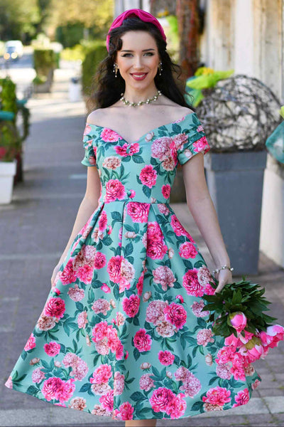 Model wearing a Pink Peony Off Shoulder Dress In Mint Green
