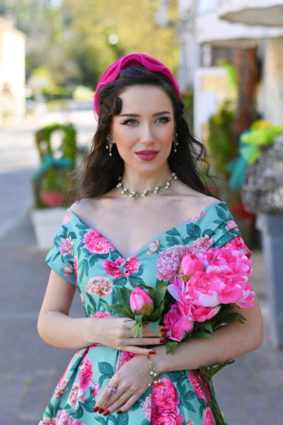 Model wearing a Pink Peony Off Shoulder Dress In Mint Green