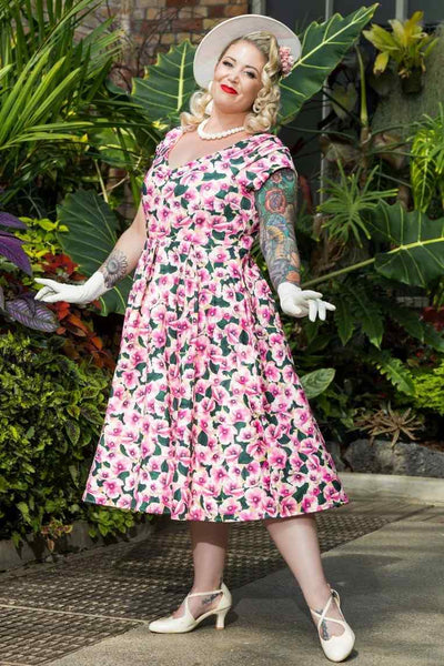 A model wearing Pink Poppy Off Shoulder Dress