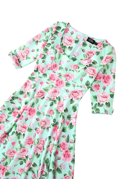 Close up view of Pink Rose Midi Dress In Baby Blue