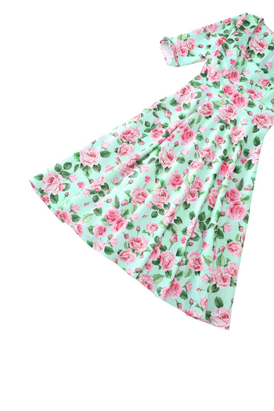 Close up view of Pink Rose Midi Dress In Baby Blue