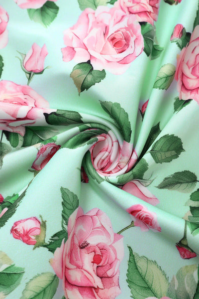 Close up view of Pink Rose Midi Dress In Baby Blue