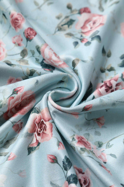 Close up view of Pink Rose Print Flared Dress In Baby Blue