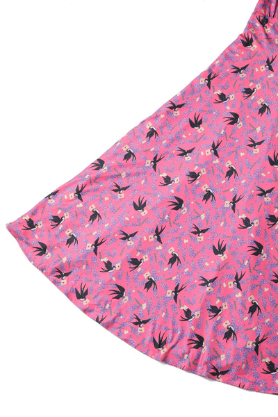 pink short sleeved tea dress, with swallow bird print, skirt view