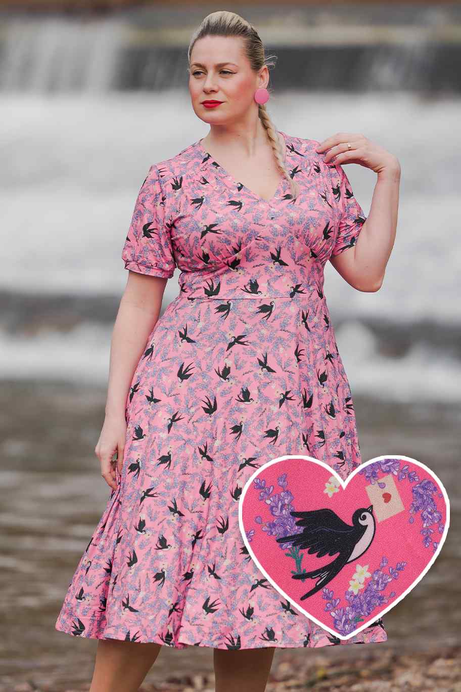 Model wears our pink short sleeved tea dress, with swallow bird print, front view
