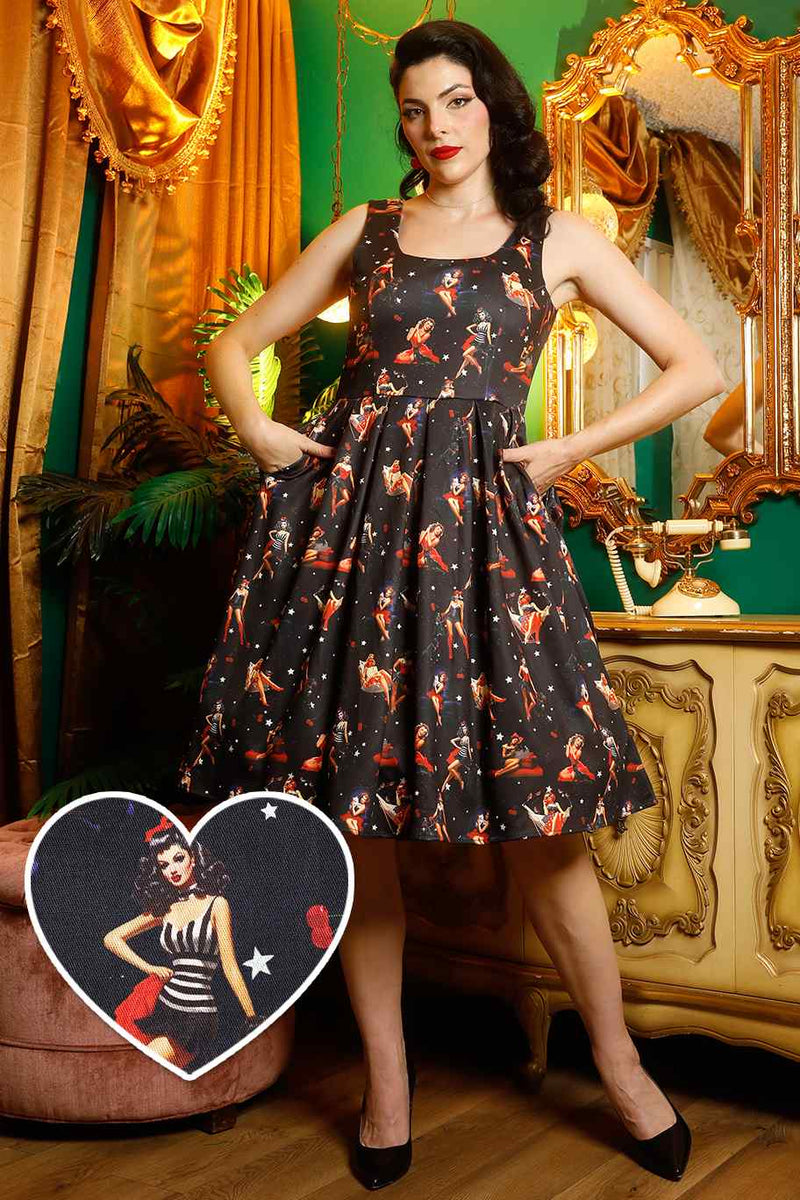 A model wearing Pinup Girls Dark Blue Dress