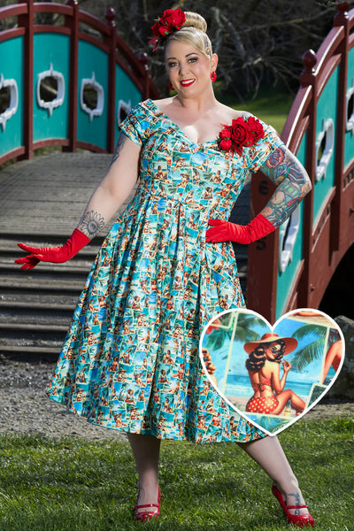 A model wearing a Lily Pinup Postcard Off Shoulder Dress