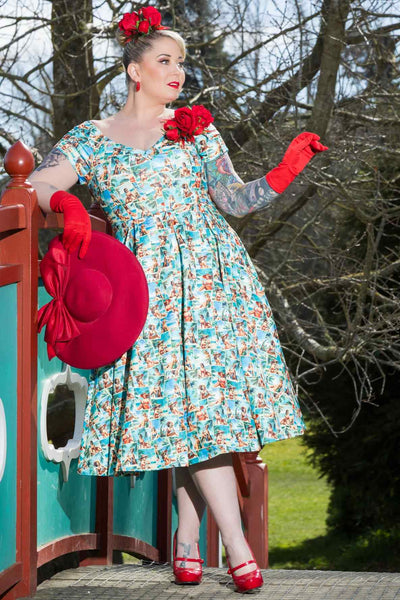 A lovely model wearing a Lily Pinup Postcard Off Shoulder Dress