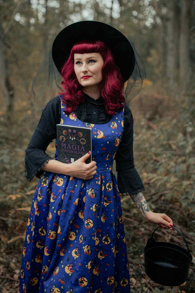 A lady wearing a Witch Print in Blue Sleeveless Swing Dress